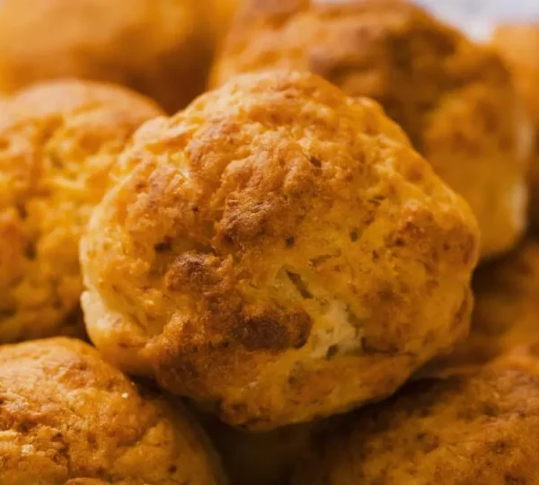 Golden-brown akara bean cakes freshly fried on the roadside, a classic Lagos street food breakfast enjoyed with pap or bread.