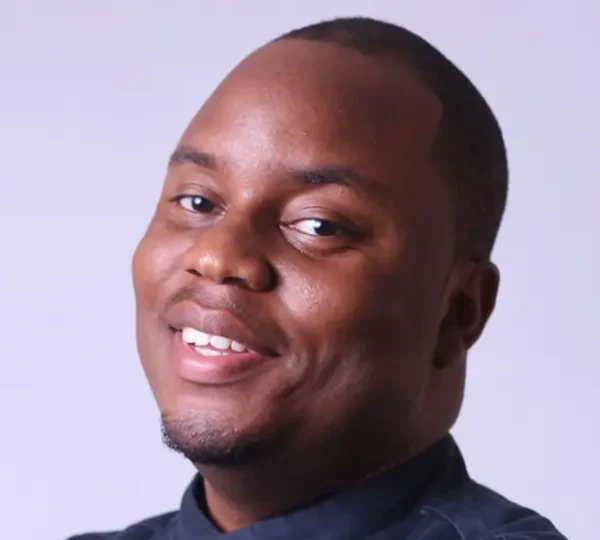 A professional Nigerian chef promoting modern dining and entrepreneurship within Nigerian food industry jobs.