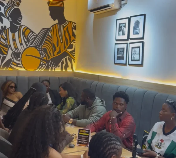 Tourists dining in a Lagos restaurant during the best time to visit Nigeria for a food tour.