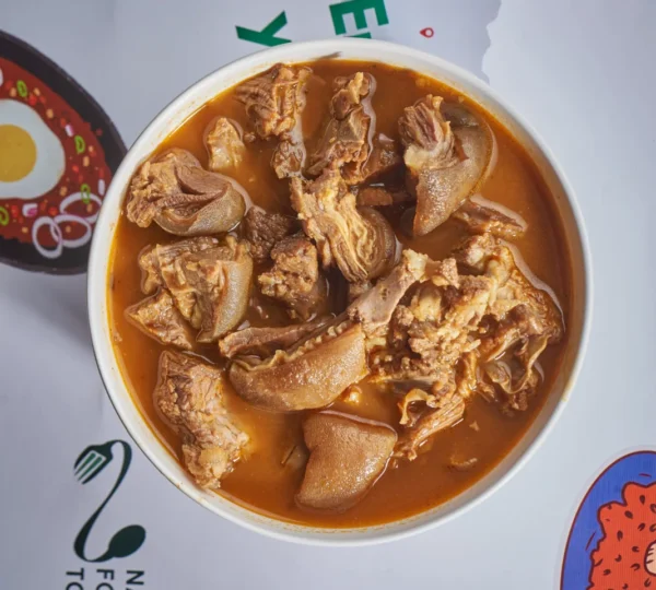 Hot and spicy Nigerian goat meat pepper soup — a comforting meal that highlights the bold flavors found in Lagos food culture.