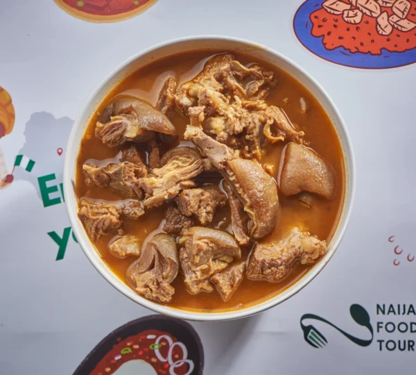 Goat meat pepper soup served in a bowl — a popular Nigerian dish often featured on food tours.
