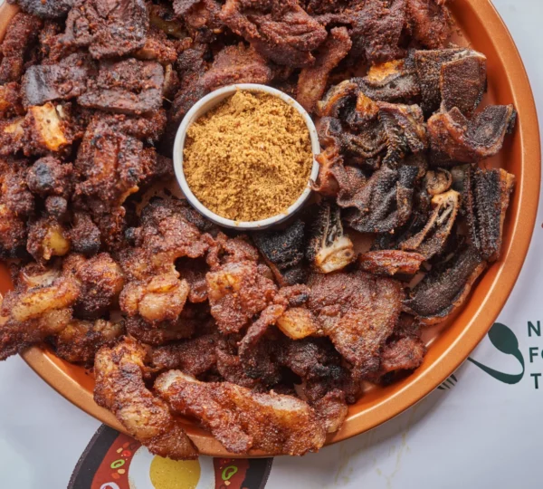 
Spicy Nigerian suya — grilled beef skewers served with pepper seasoning, a late-night street favorite that defines Lagos food culture.