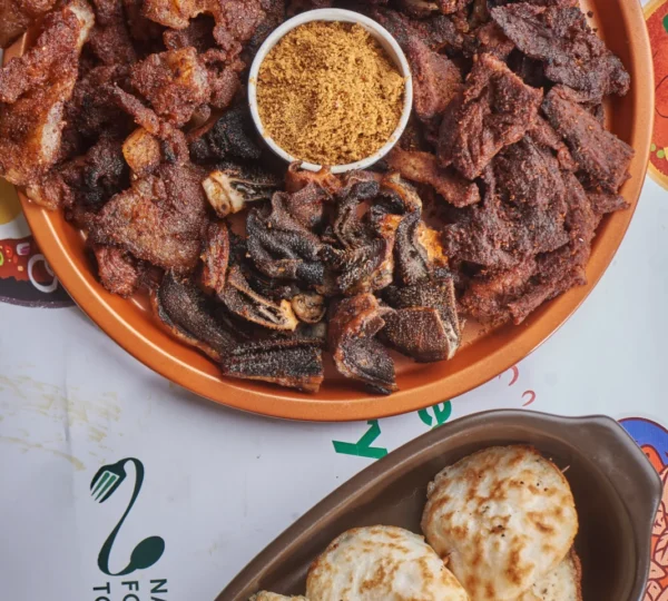 A reimagined gourmet suya platter with beef, ram, and chicken suya, showcasing modern Naija gourmet food presentation.