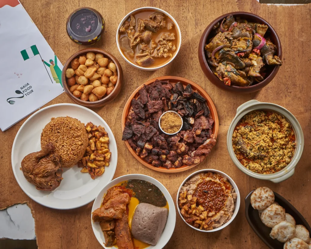 Assorted Nigerian traditional dishes displayed on a table — showcasing the most famous food in Nigeria for tourists.