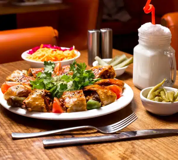 Delicious Nigerian meal served at one of the top restaurants in Lagos Nigeria with salad and milkshake.